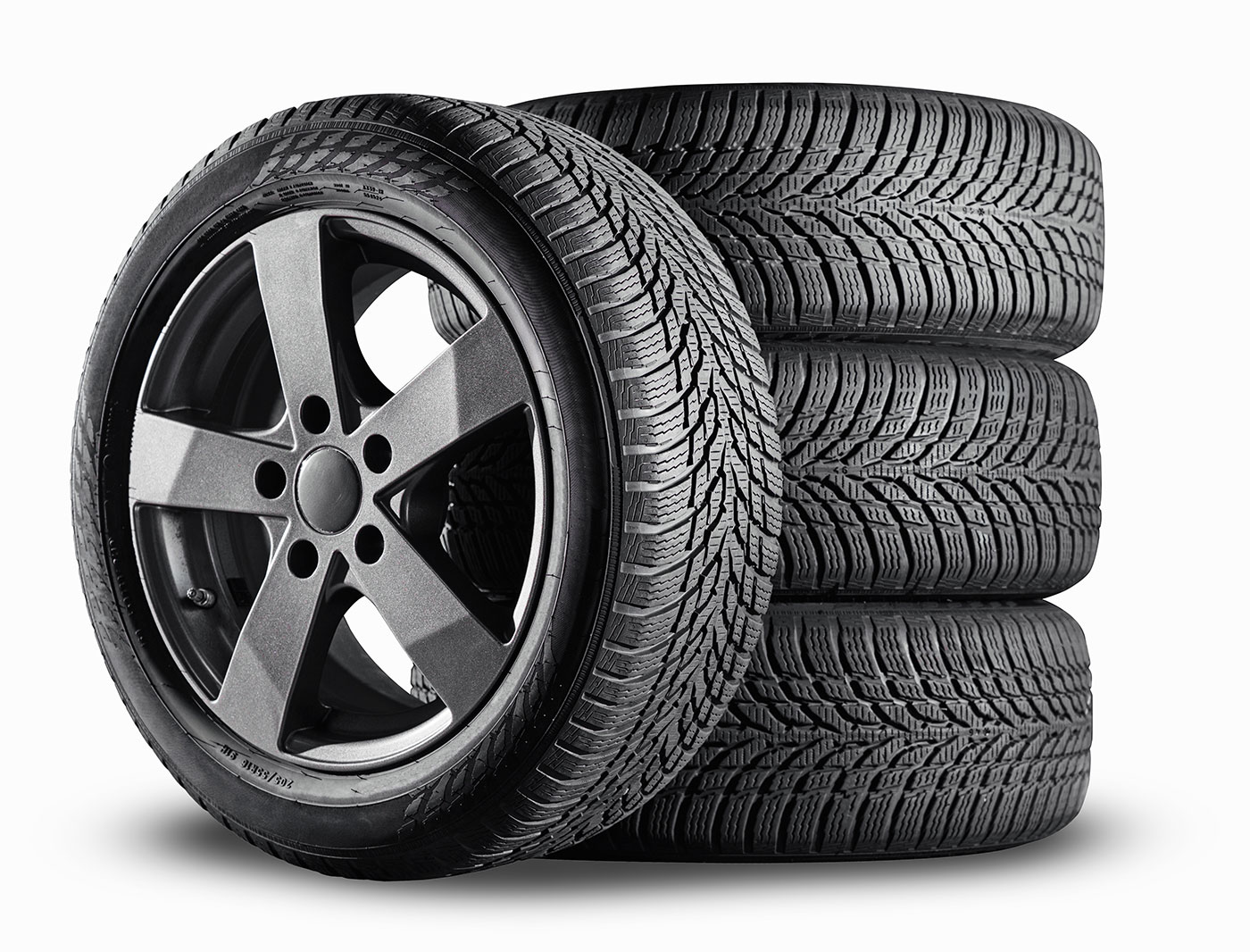 Stack of new tires with a custom wheel